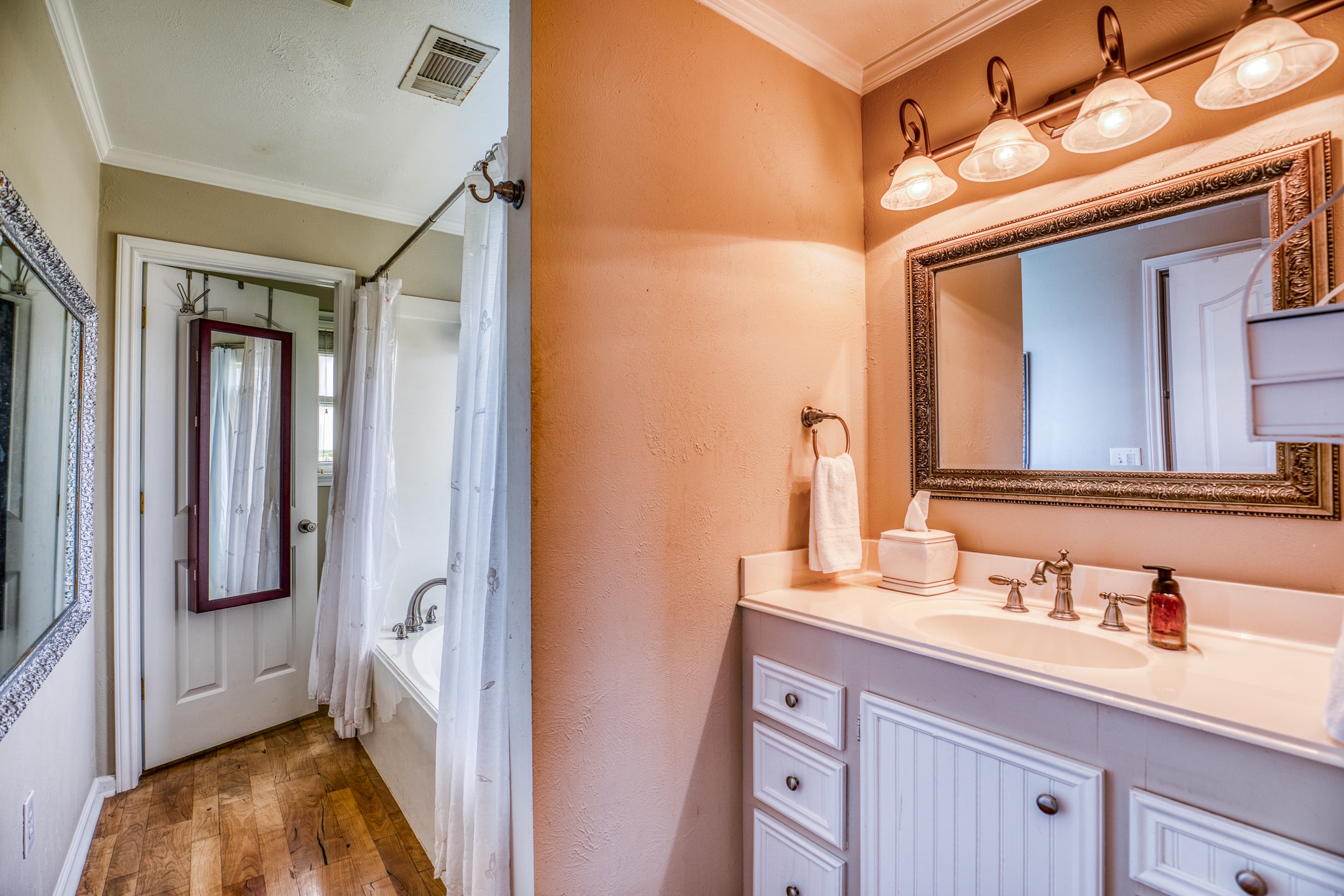 20751 Fm 1155 Street East Washington, TX 77880 - Photo 19 of 49 a en suite bathroom with a sink and a mirror