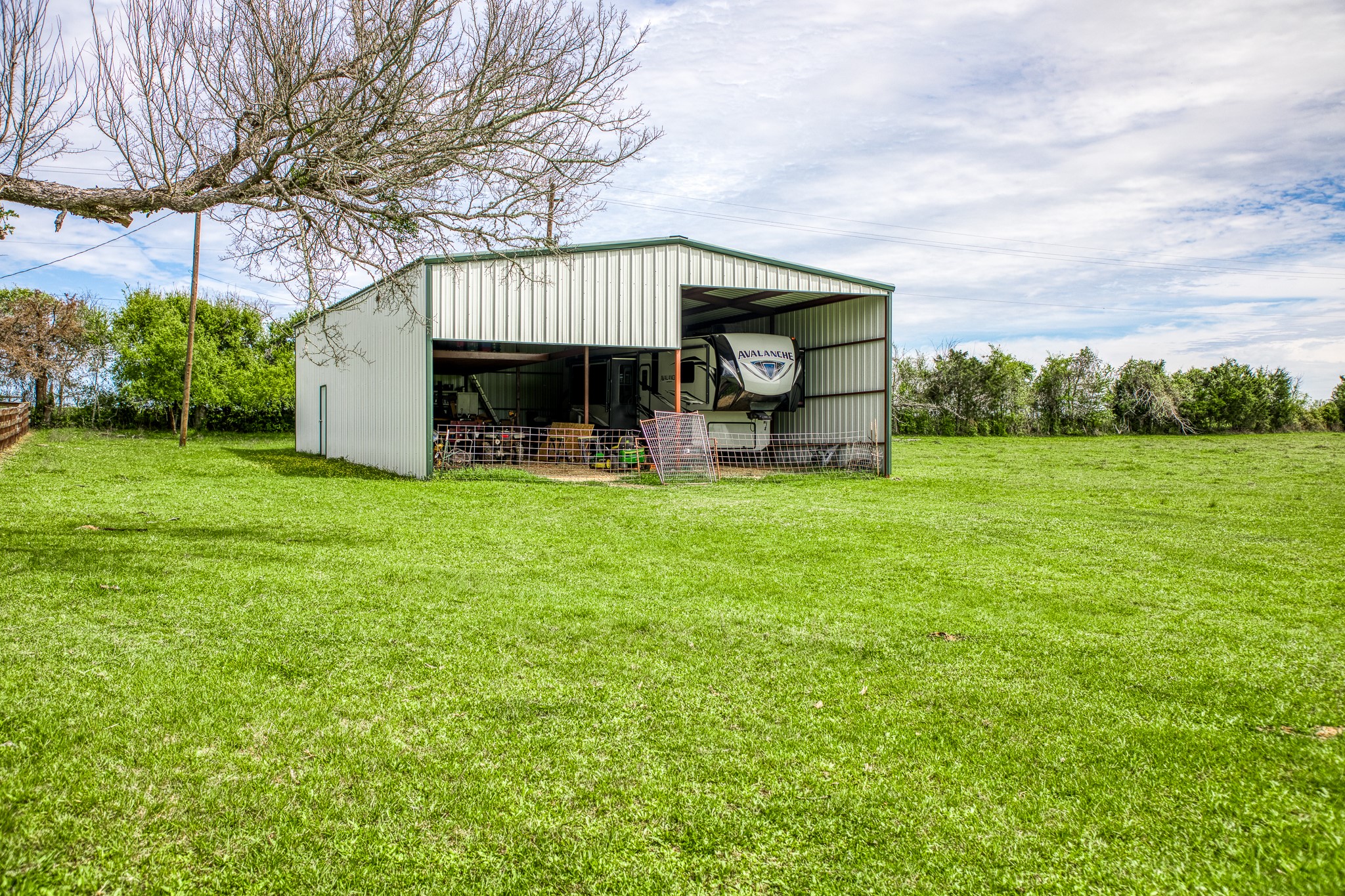20751 Fm 1155 Street East Washington, TX 77880 - Photo 25 of 49 a view of a house with a yard and sitting area