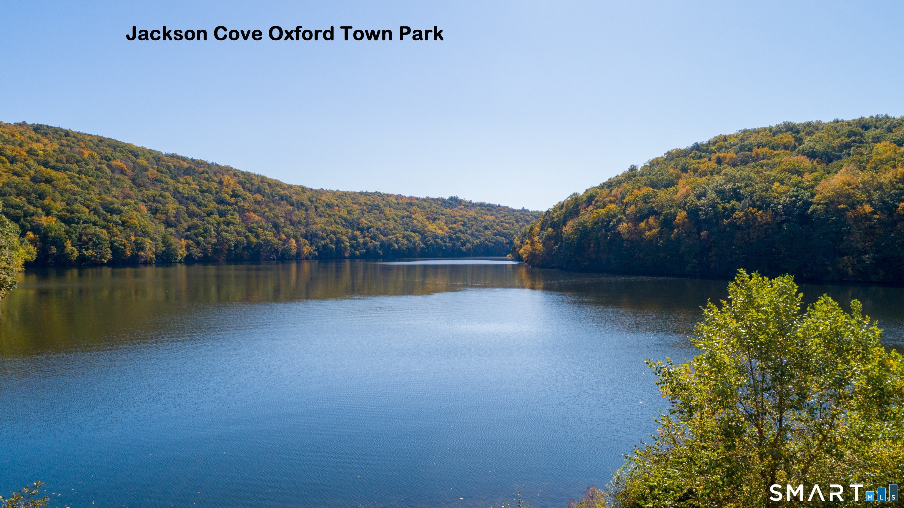 223 Meadow Brook Road, Unit 223 Oxford, CT 06478 - Photo 28 of 34 a view of a lake with a mountain in the background
