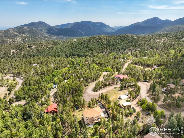 a balcony with table and chairs