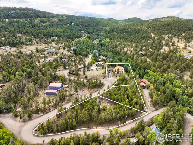 an aerial view of a house with a garden