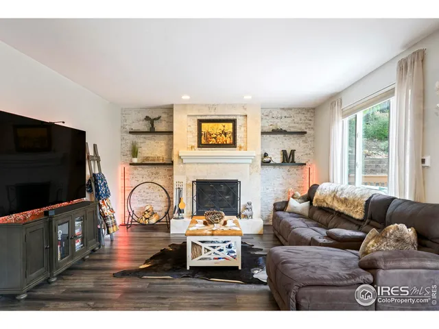 a kitchen with stainless steel appliances kitchen island granite countertop a sink and cabinets