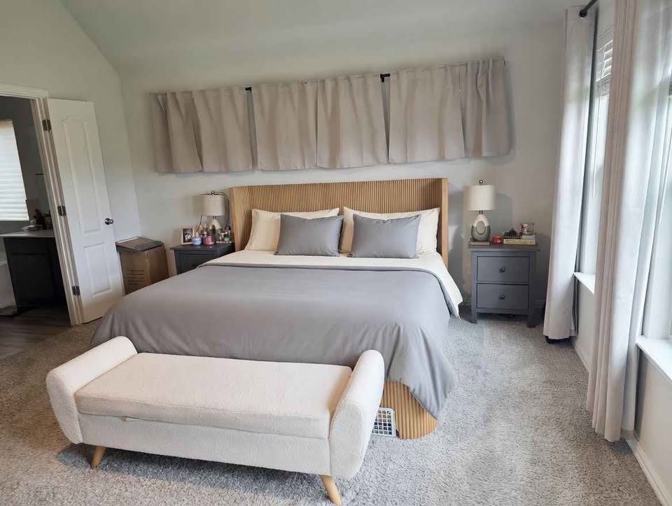 4105 Gildas Path Pflugerville, TX 78660 - Photo 7 of 15 A tranquil bedroom features a soft grey palette, creating a serene personal retreat.