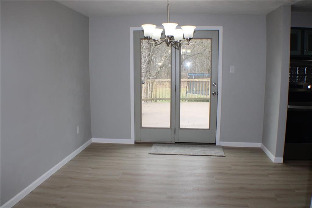 626 Ekastown Road Sarver, PA 16055 - Photo 27 of 50 a view of an empty room with wooden floor and a window