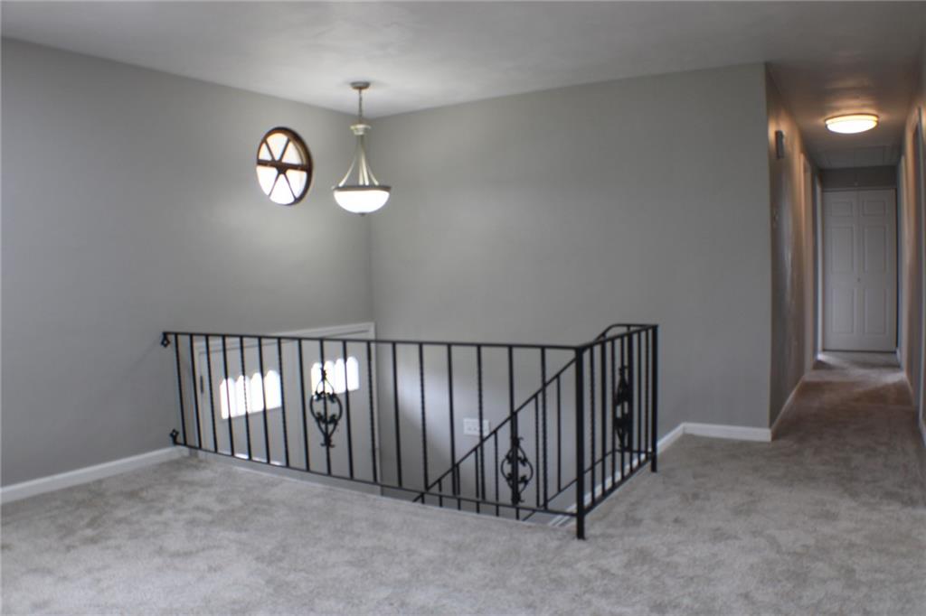 626 Ekastown Road Sarver, PA 16055 - Photo 31 of 50 an empty room with windows and fireplace