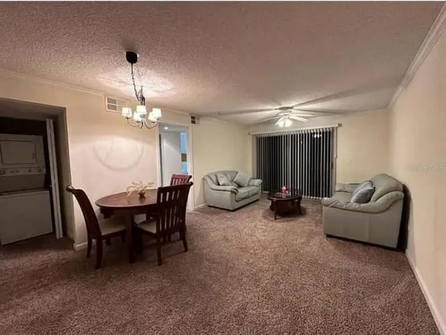 a bedroom with a bed chair and window