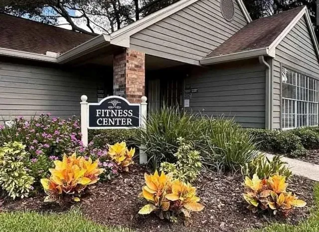 a sign that is on a brick wall