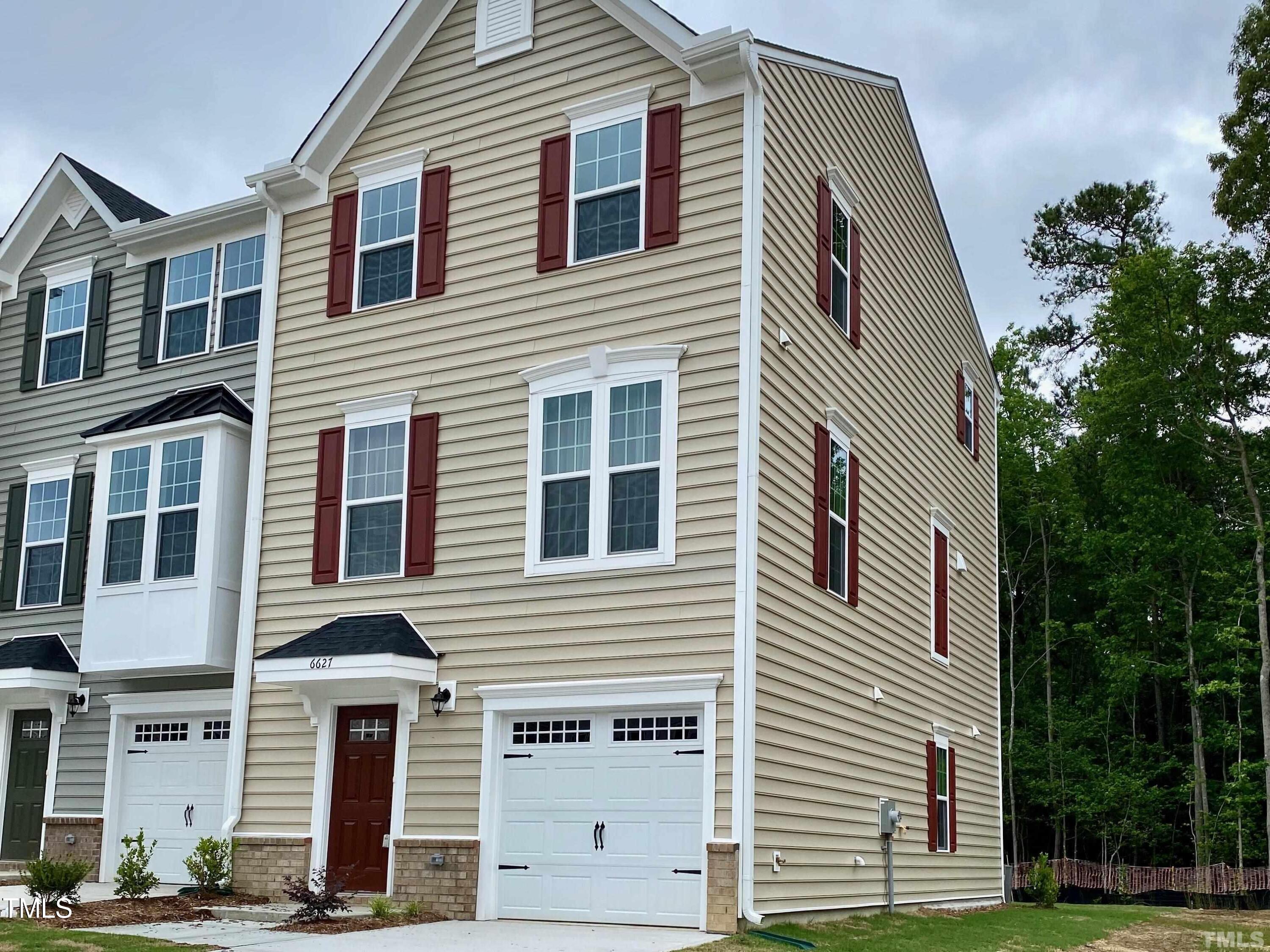 6627 Pathfinder Way Raleigh, NC 27616 - Photo 1 of 35 a front view of a house with a yard