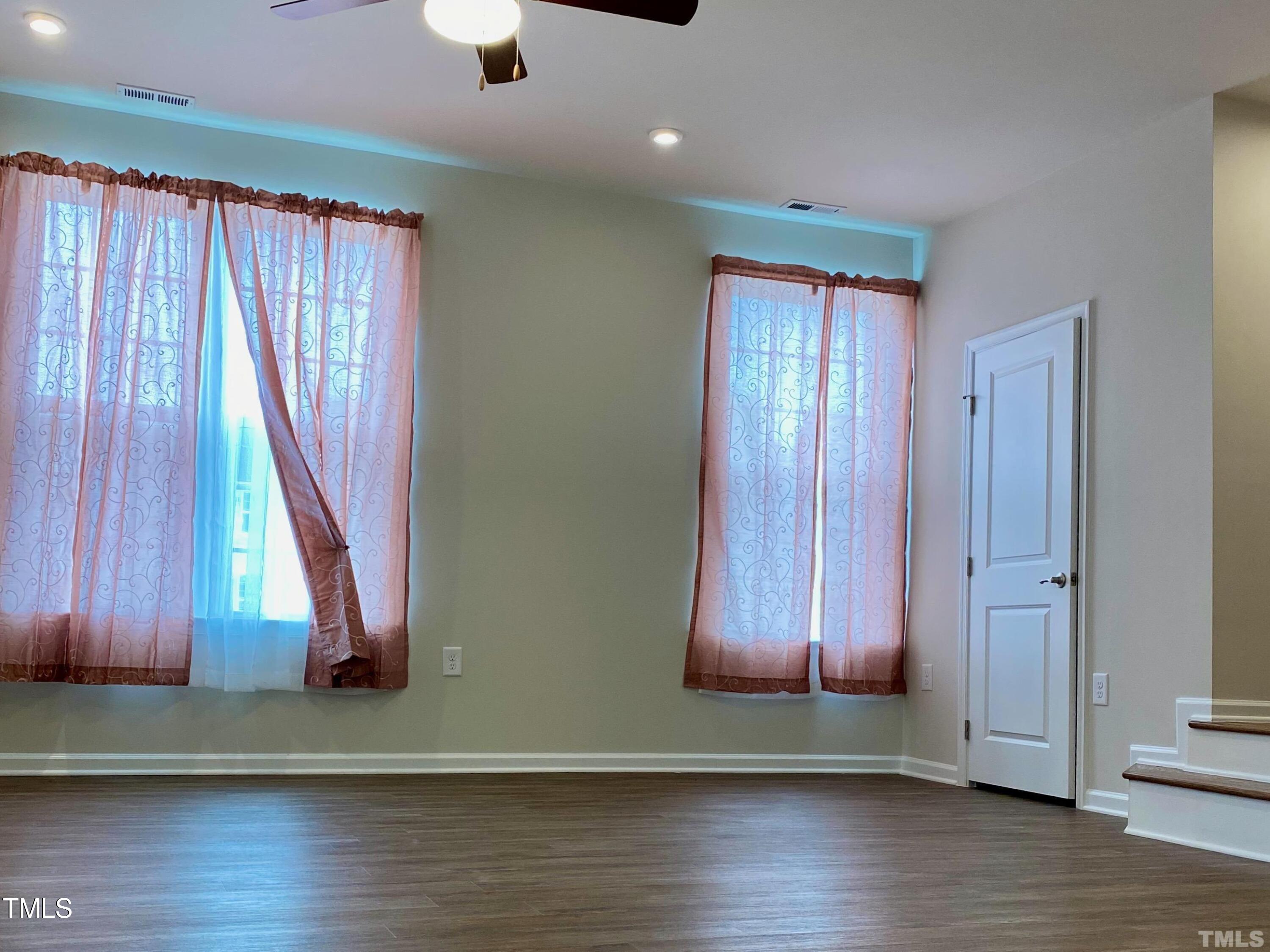 6627 Pathfinder Way Raleigh, NC 27616 - Photo 20 of 35 a view of a door with wooden floor
