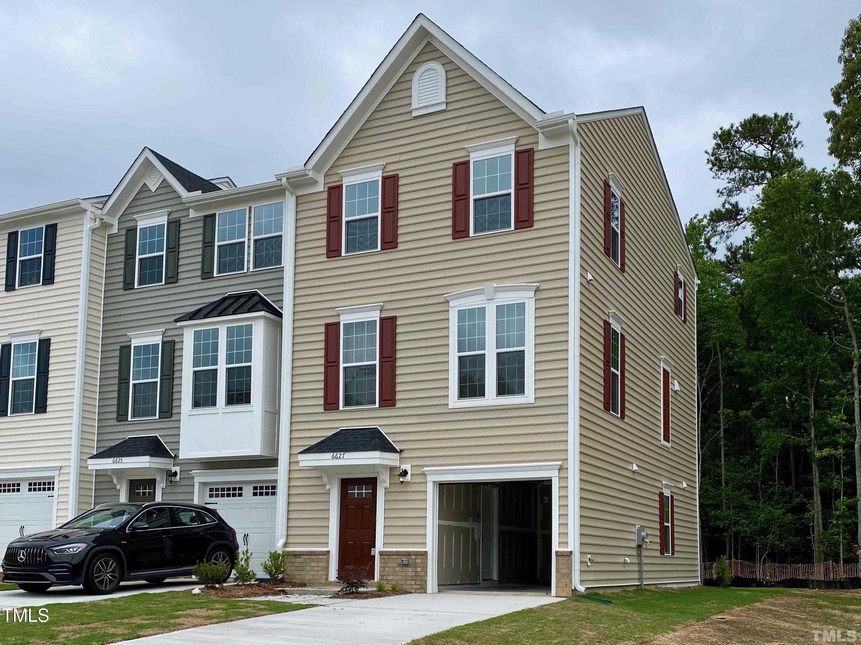 6627 Pathfinder Way Raleigh, NC 27616 - Photo 2 of 35 a front view of a house with a yard