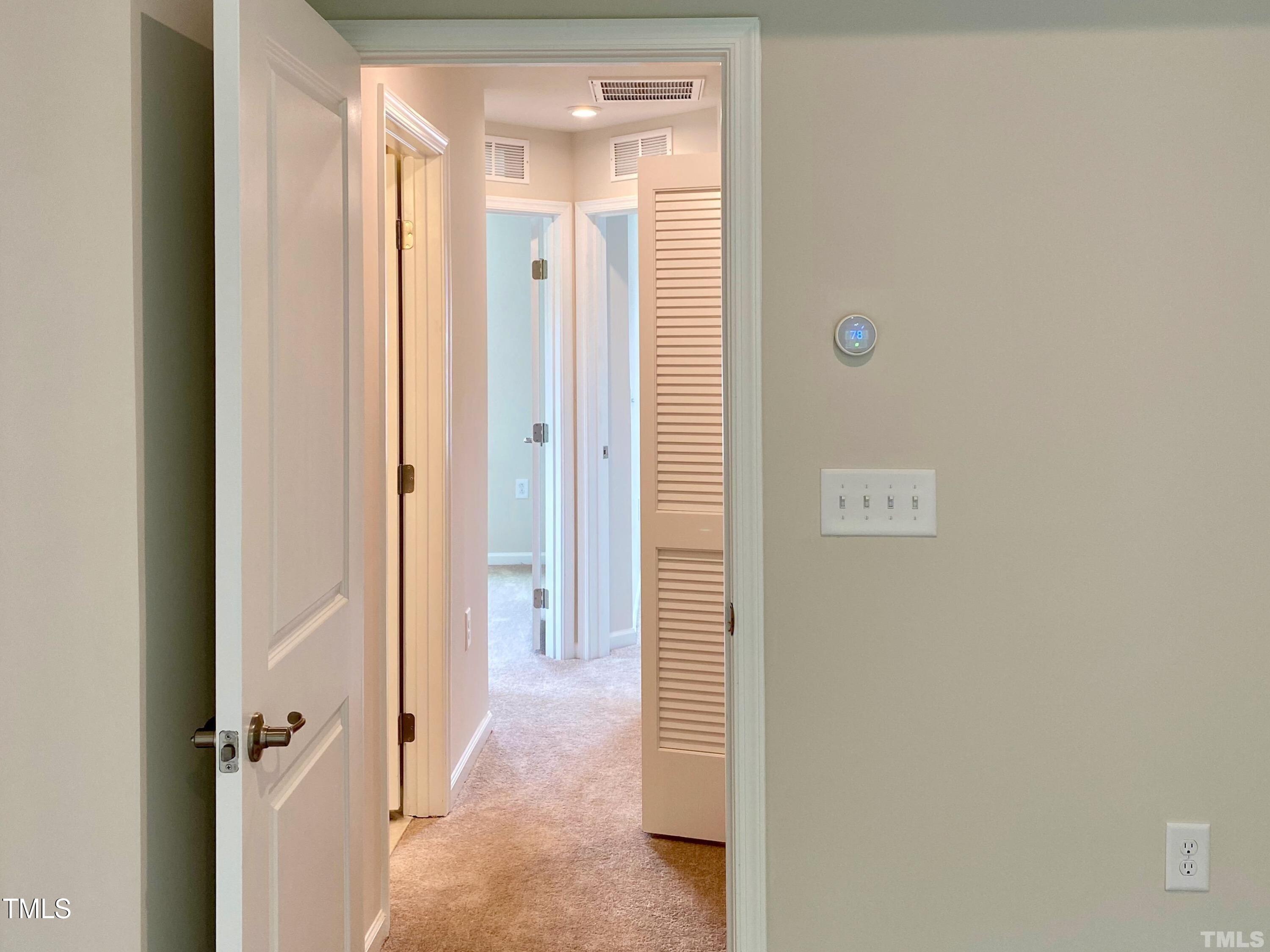 6627 Pathfinder Way Raleigh, NC 27616 - Photo 23 of 35 a view of a bathroom with a shower and a door