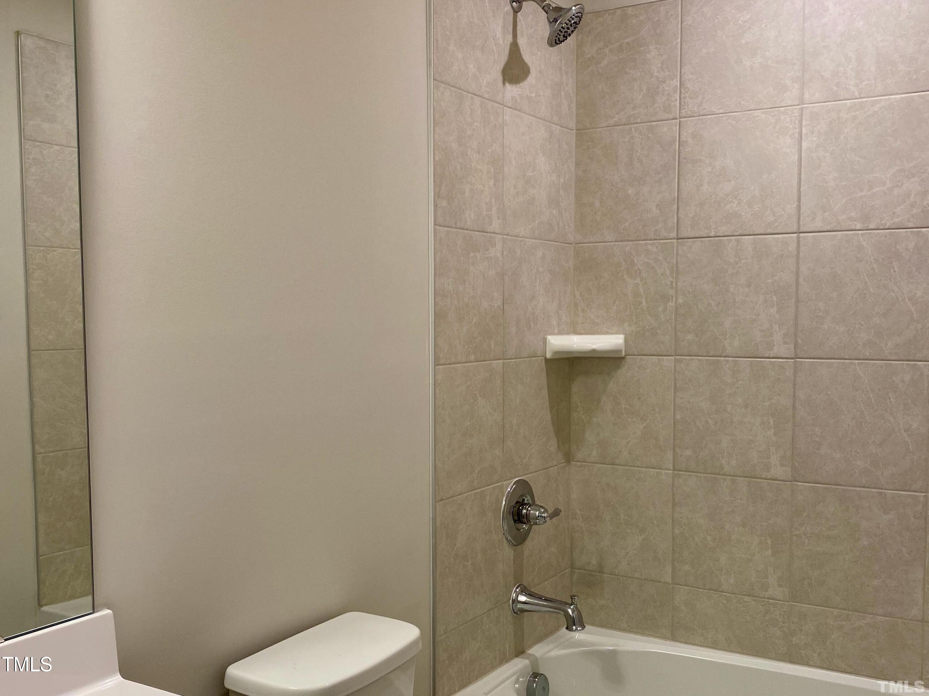 6627 Pathfinder Way Raleigh, NC 27616 - Photo 30 of 35 a bathroom with a toilet and a shower