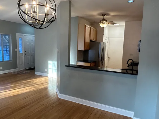 a view of a livingroom with furniture and chandelier