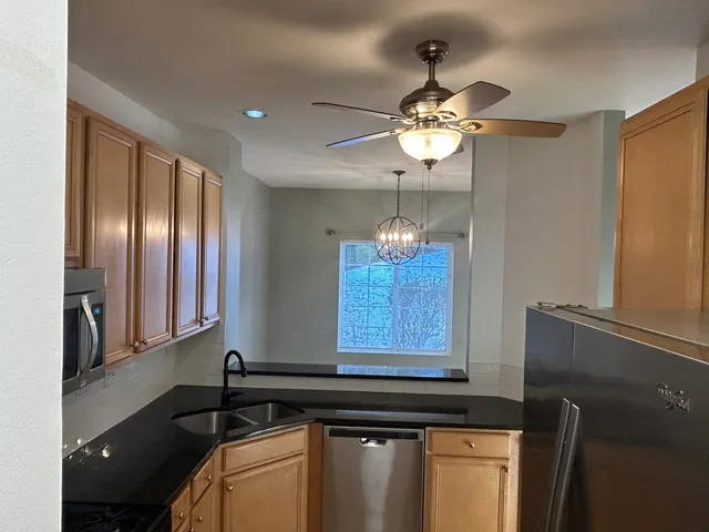 a kitchen with a chandelier