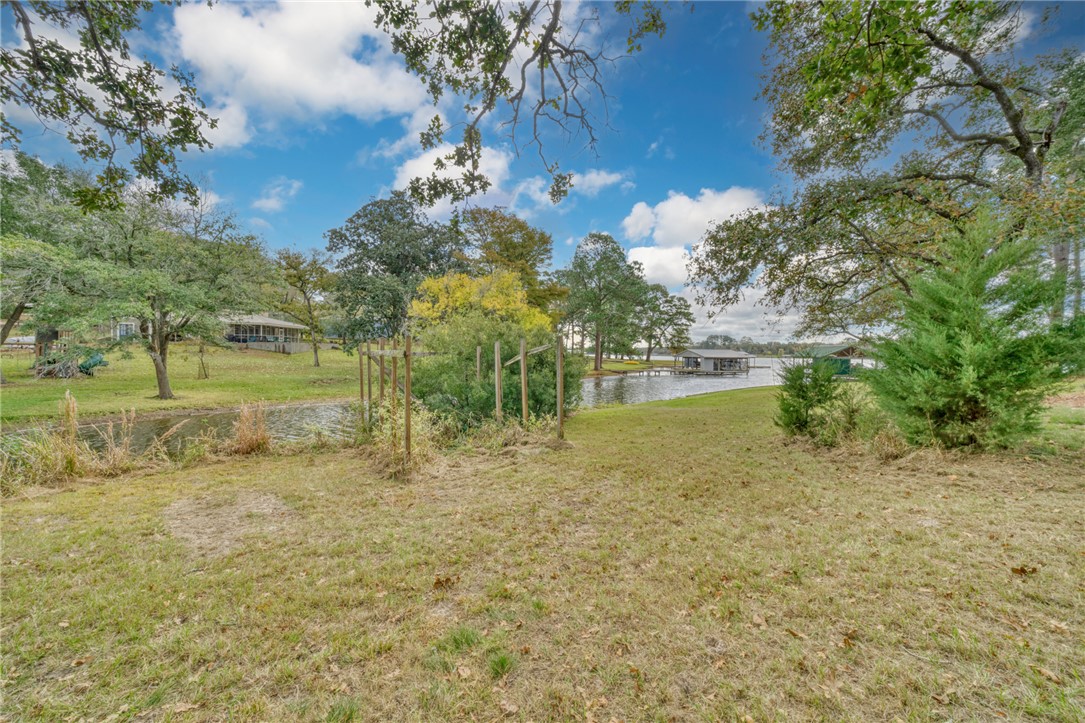10232 Riley Green Road Franklin, TX 77856 - Photo 20 of 40 View of green lawn featuring a water view