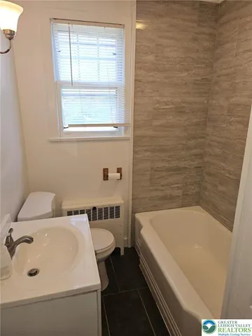 a bathroom with a sink and a bathtub