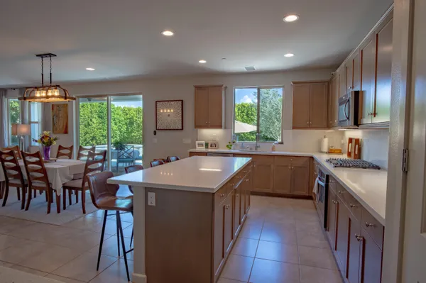 a kitchen with appliances and cabinets