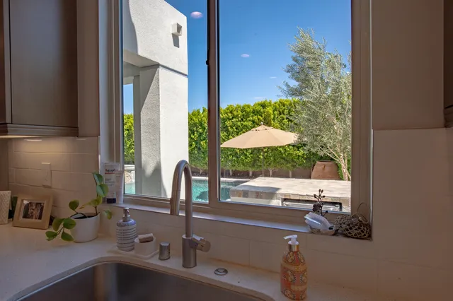 a view of a chairs and table in patio