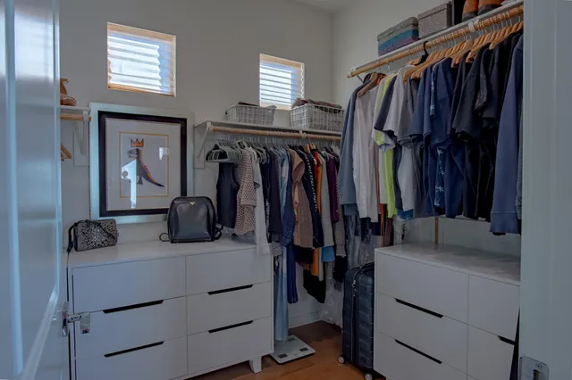 an aerial view of multiple houses with a yard