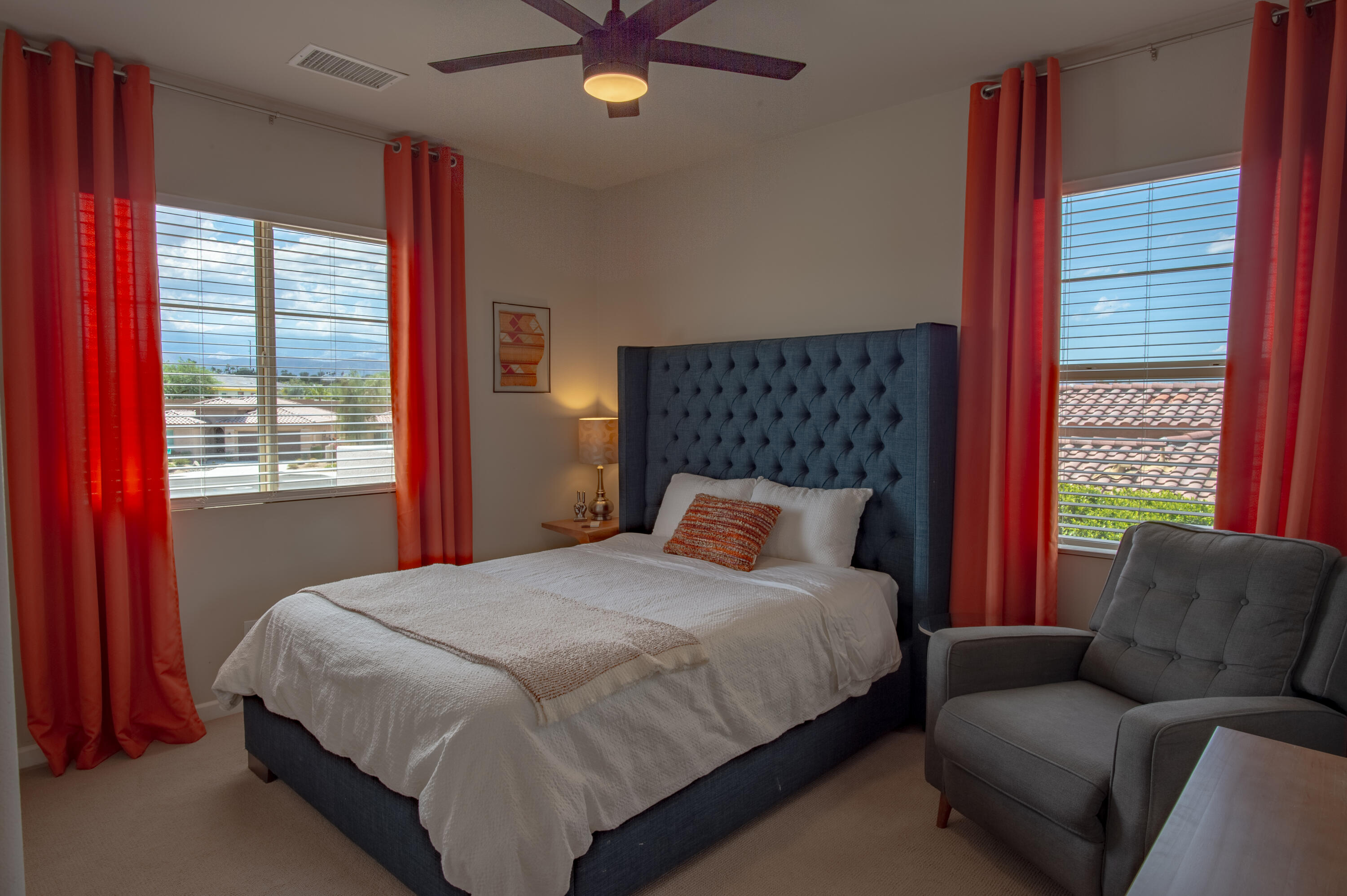 74500 Xander Court Palm Desert, CA 92211 - Photo 31 of 36 a bedroom with a bed couch and window