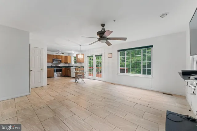 a view of work space with windows and furniture