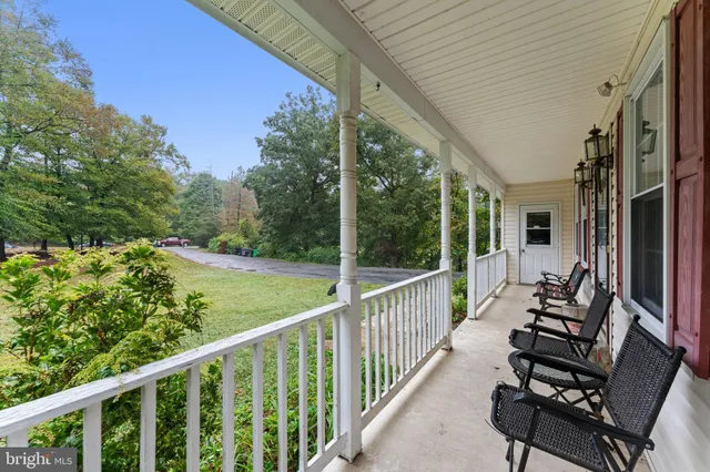 a view of balcony with furniture