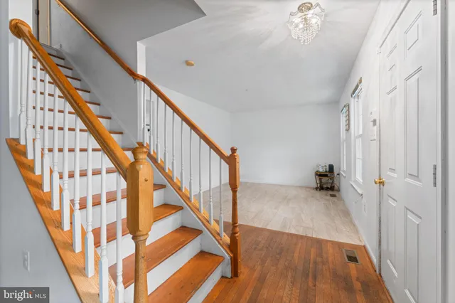 a view of staircase with wooden floor and staircase
