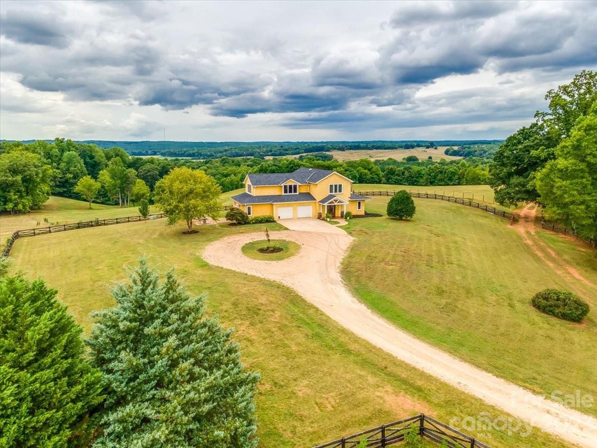 2696 Scenic View Road Hickory Grove, SC 29717 - Photo 1 of 1 a view of a swimming pool with an outdoor seating and a garden