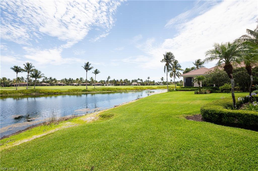 2145 Canna Way Naples, FL 34105 - Photo 23 of 49 a view of a lake with houses in the back