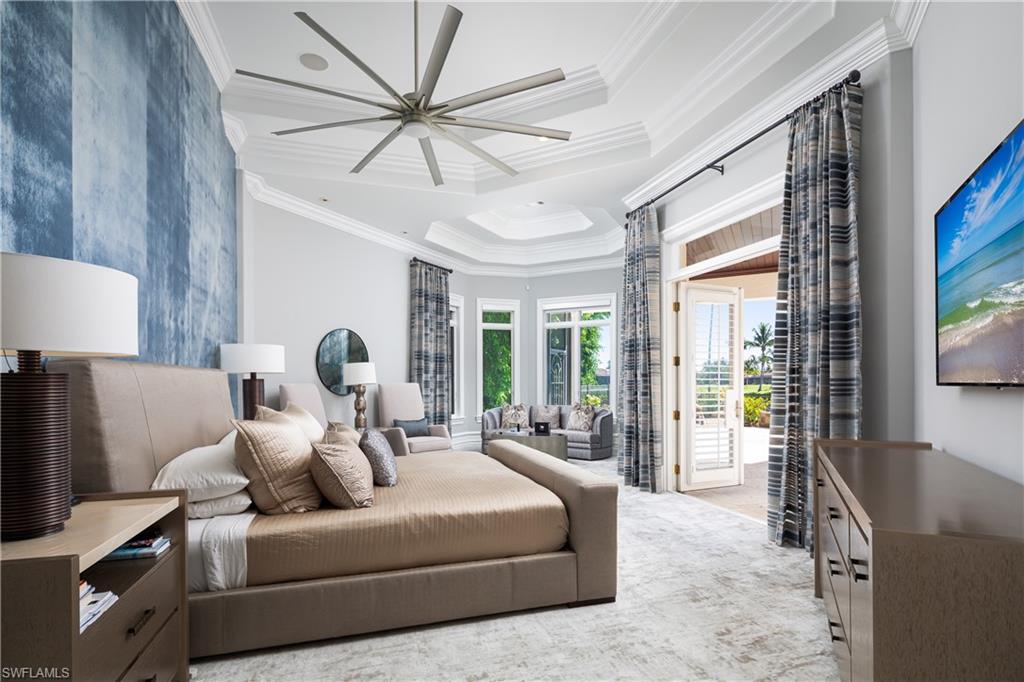 2145 Canna Way Naples, FL 34105 - Photo 30 of 49 a living room with furniture and a large window