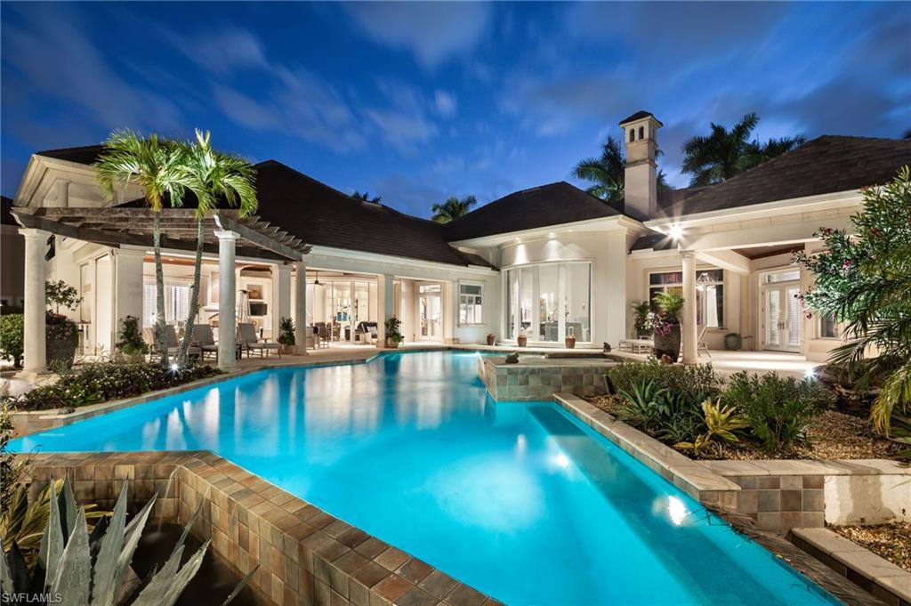 2145 Canna Way Naples, FL 34105 - Photo 4 of 49 a view of a house with swimming pool and sitting area