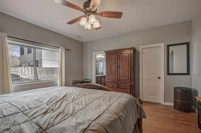 a bedroom with a large bed and a tv