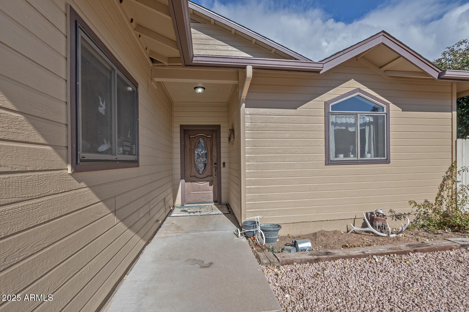 406 Granite Butte Road Star Valley, AZ 85541 - Photo 2 of 24 a view of a house with wooden fence