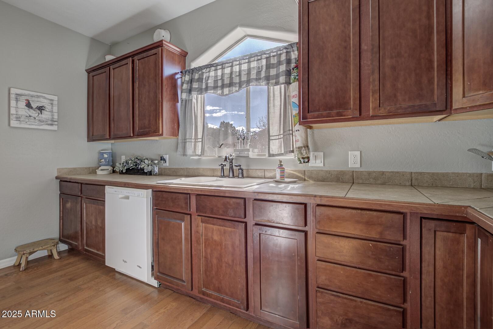 406 Granite Butte Road Star Valley, AZ 85541 - Photo 7 of 24 a kitchen with a sink cabinets and window
