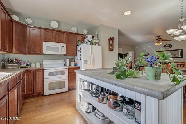 a kitchen with stainless steel appliances granite countertop a stove and a sink