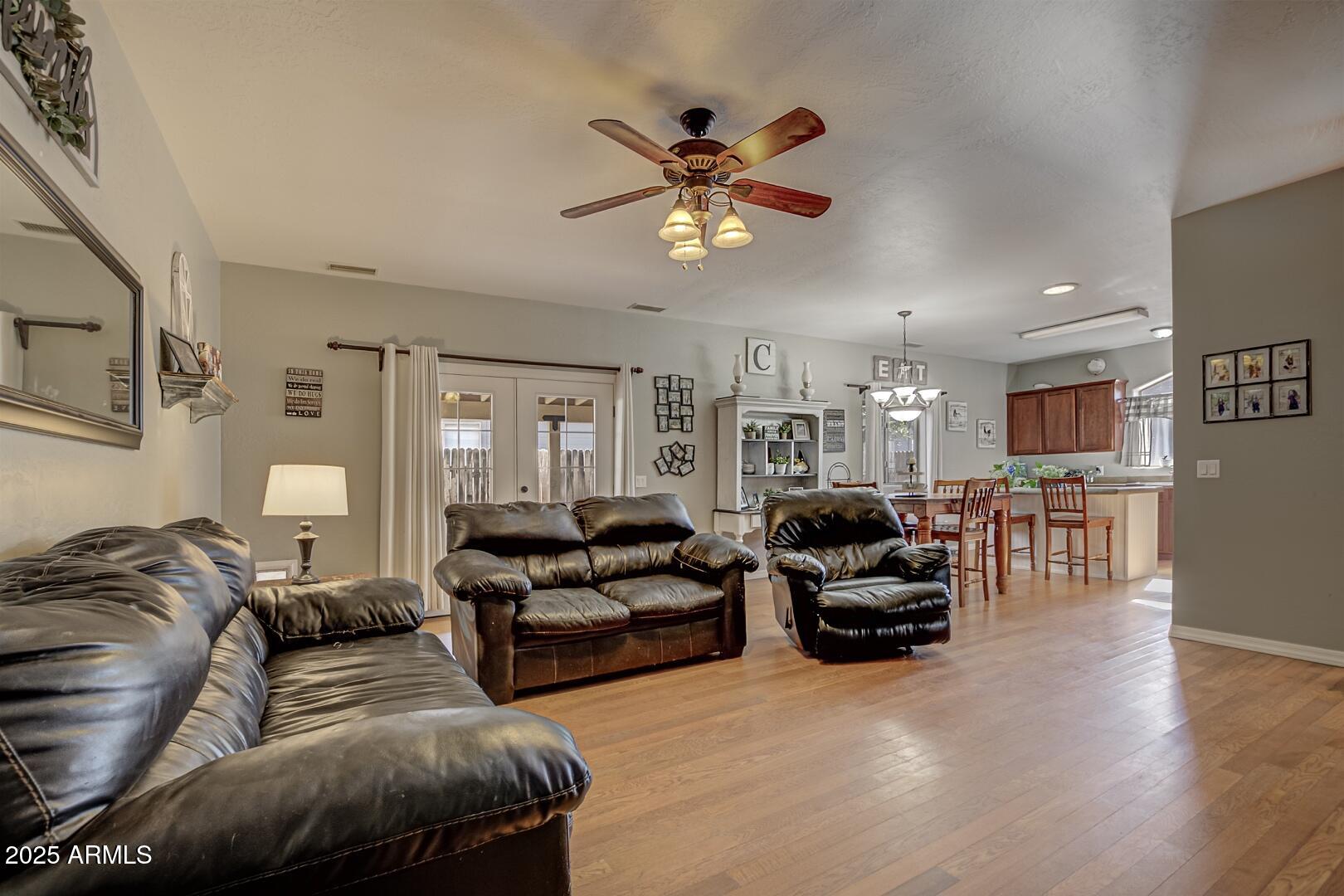 406 Granite Butte Road Star Valley, AZ 85541 - Photo 9 of 24 a living room with furniture ceiling fan and a rug