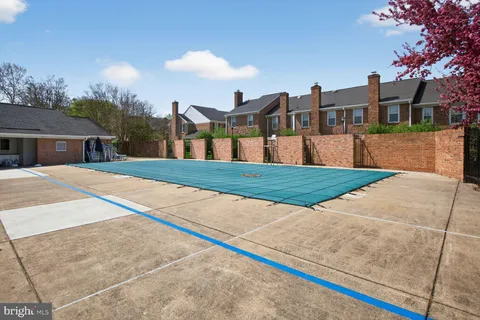 a view of swimming pool with a yard