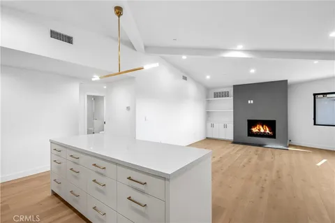 a view of a room with furniture and a fireplace