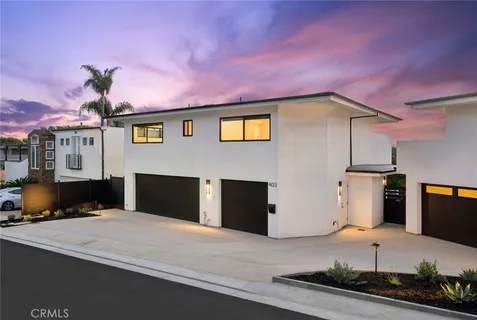a front view of a house with a garage