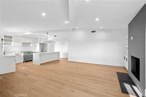 a view of kitchen with wooden floor