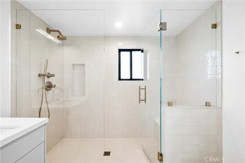 a bathroom with a shower and a sink