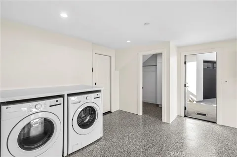 a view of a hallway with a utility room