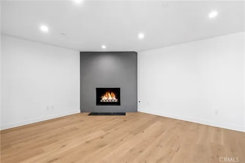 an empty room with a fireplace