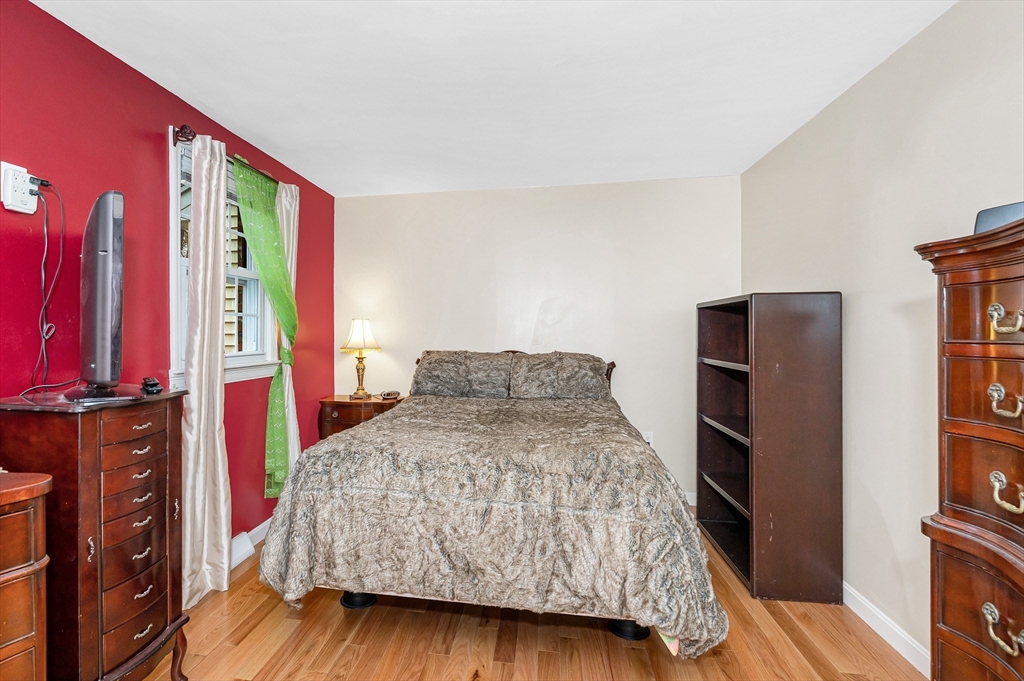 454 Dunstable Road Tyngsborough, MA 01879 - Photo 16 of 41 a bedroom with a bed and a television