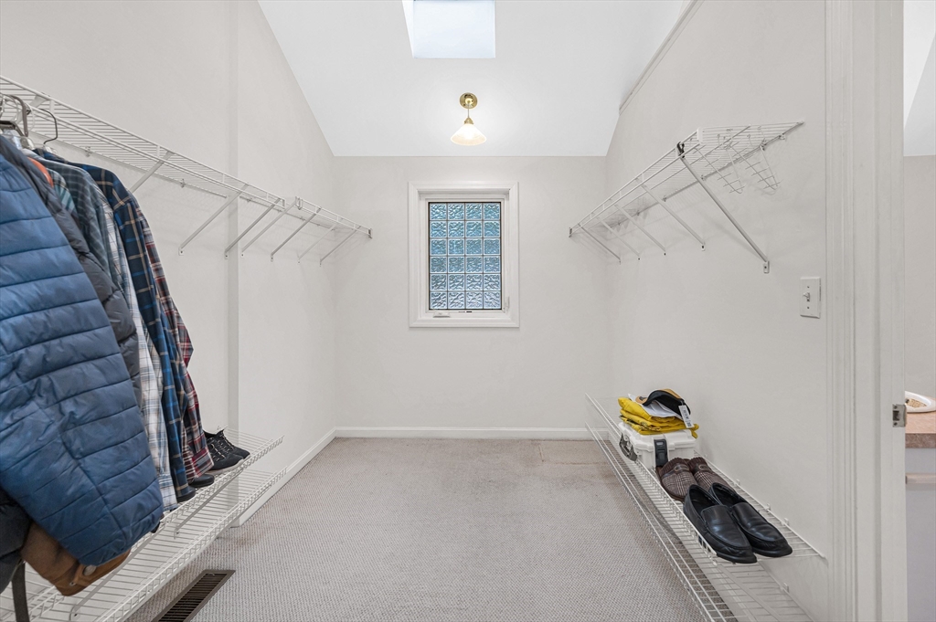 454 Dunstable Road Tyngsborough, MA 01879 - Photo 24 of 41 a view of storage and utility room with stairs