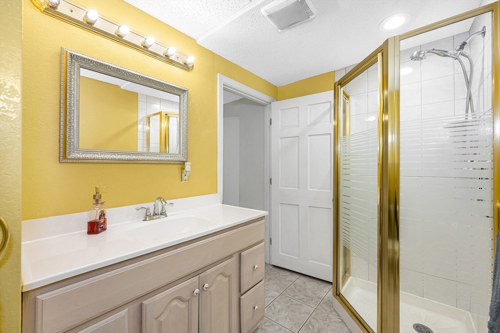 454 Dunstable Road Tyngsborough, MA 01879 - Photo 29 of 41 a bathroom with a sink and a mirror