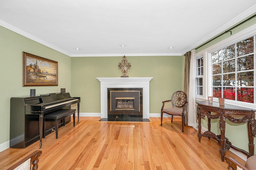 454 Dunstable Road Tyngsborough, MA 01879 - Photo 3 of 41 a living room with furniture and a fireplace