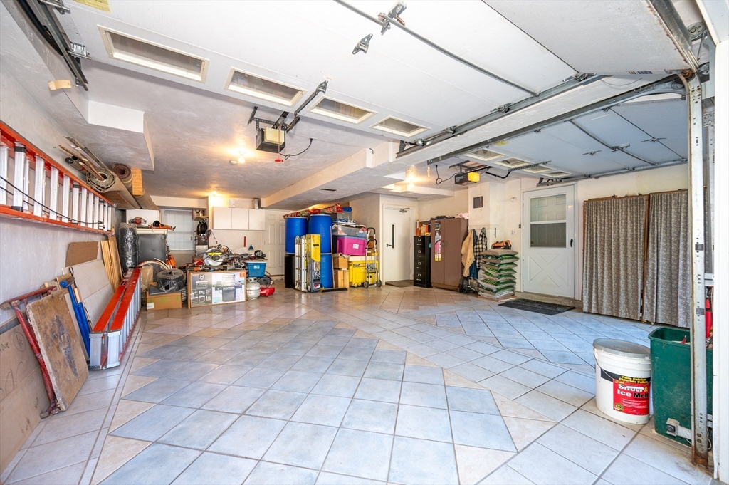 454 Dunstable Road Tyngsborough, MA 01879 - Photo 35 of 41 a view of a garage with stairs