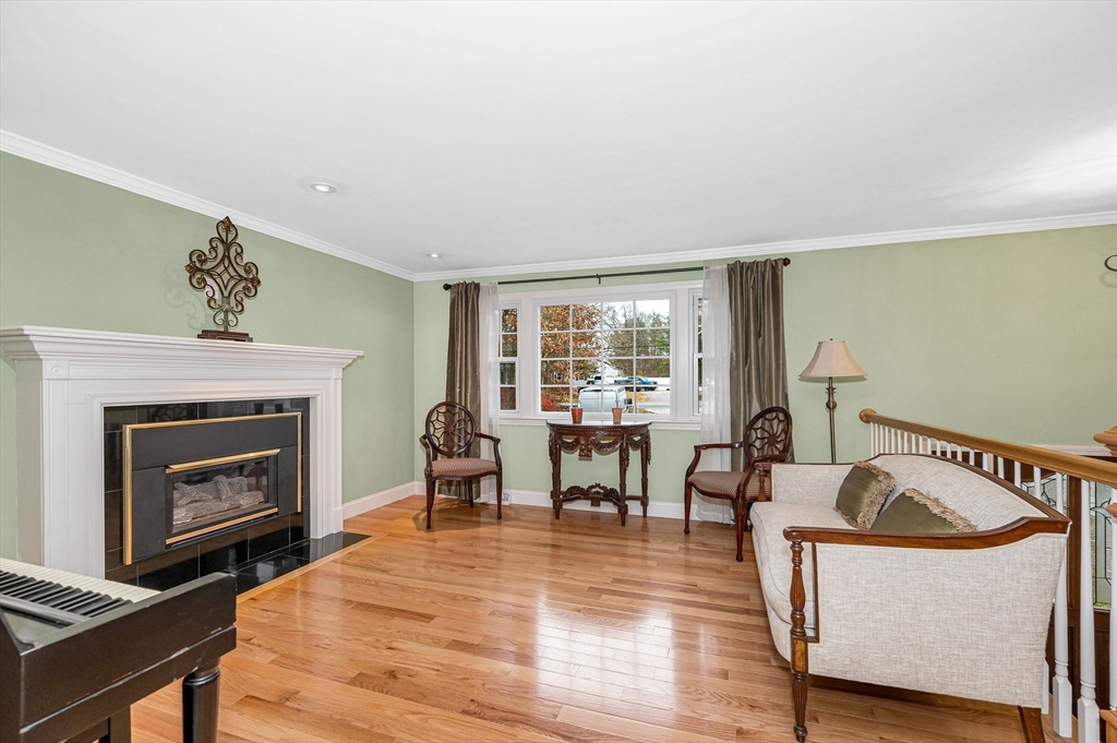 454 Dunstable Road Tyngsborough, MA 01879 - Photo 4 of 41 a living room with furniture and a fireplace