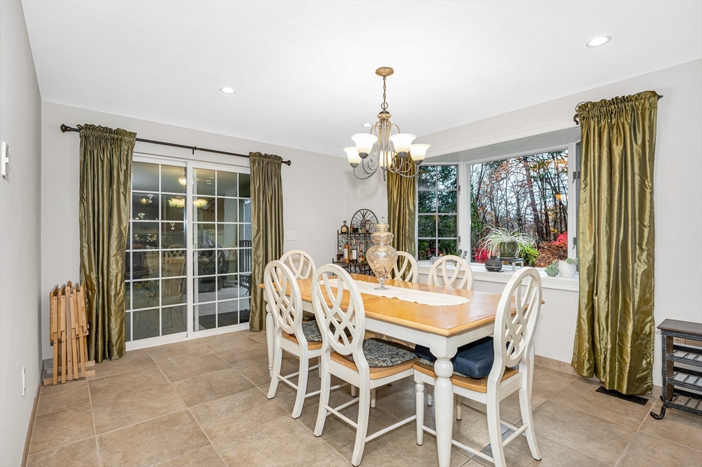 454 Dunstable Road Tyngsborough, MA 01879 - Photo 10 of 41 a dining room with furniture a chandelier and window